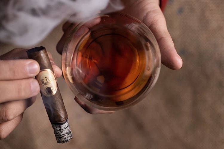 Oliva cigar and drink on Instagram