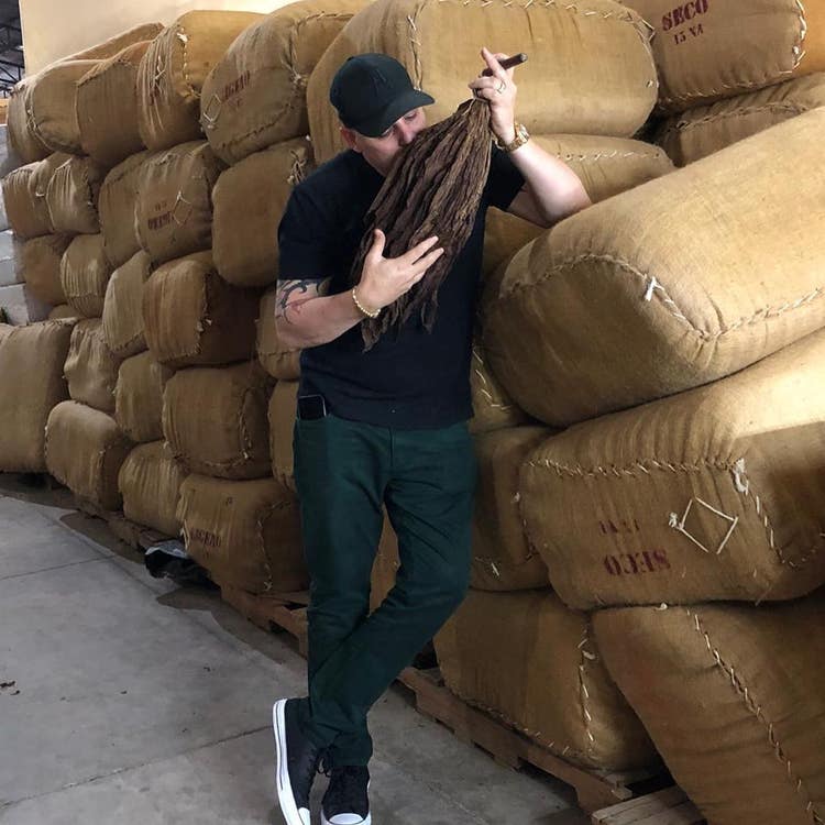 10 top rated AJ Fernandez Cigars AJ Fernandez inspecting bales of tobacco