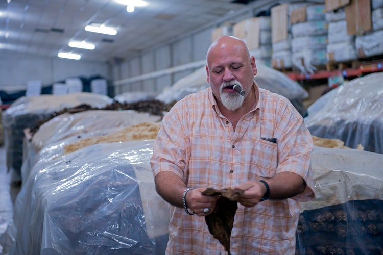 Steve Saka of Dunbarton tobacco pilon of tobacco