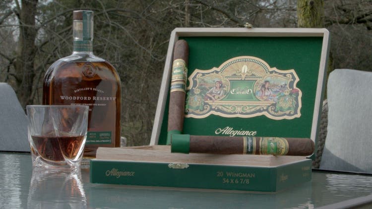 cigar advisor #nowsmoking cigar review e.p. carrillo allegiance - setup shot of cigars resting on open box with whiskey in the background