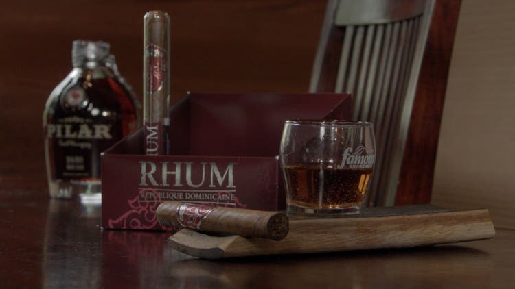 cigar advisor #nowsmoking cigar review ted's rhum - shot of cigars with box and whiskey in background