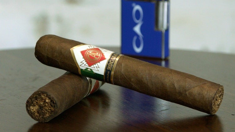 two CAO Zocalo cigars and cigar lighter