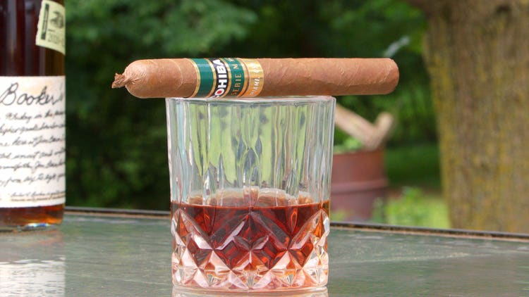 cigar advisor #nowsmoking cigar review - drink paiting with cigar sitting on rocks glass