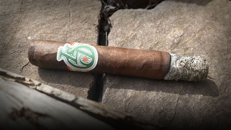 Cigar Advisor #nowsmoking Cigar Review Los Statos Deluxe part 1 - smoking the cigar, resting on rock ashtray
