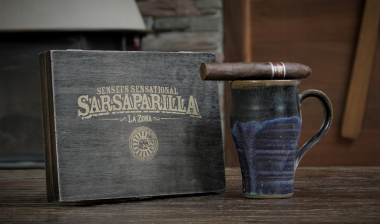 cigar advisor now smoking video cigar review sensei's sensational sarsaparilla setup 2 with cigaron a coffee mug next to the box