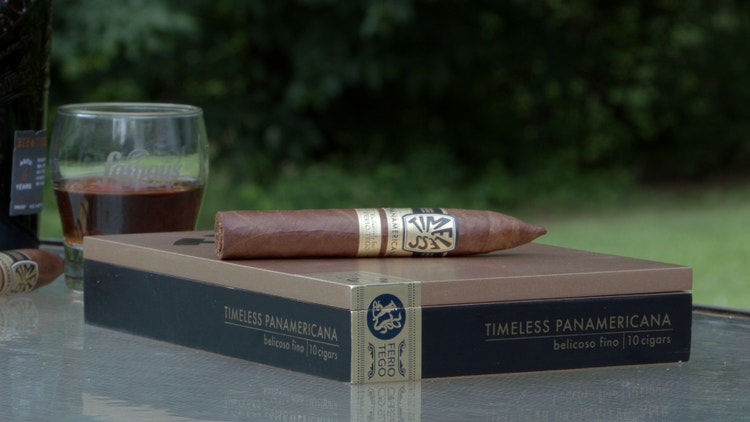 cigar advisor #nowsmoking cigar review ferio tego timeless panamericana - cigar on its box with whiskey glass in the background