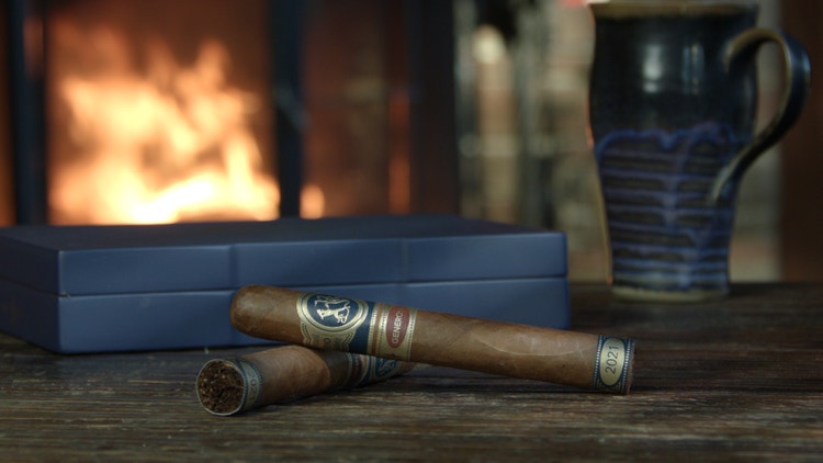 cigar advisor #nowsmoking cigar review - ferio tego generoso cigars displayed in front of fireplace