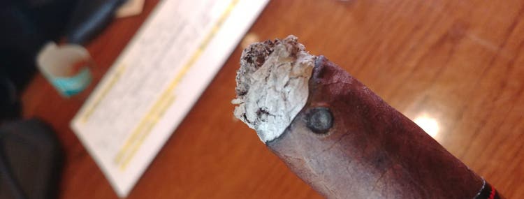 Cigar Questions Smokers are Actually Asking How do I fix a cigar that isn't burning straight this is what a mouse hole burn looks like