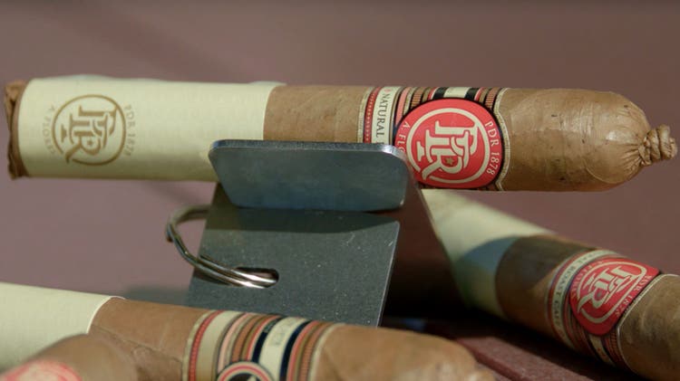 PDR cigars PDR 1878 Natural Roast Café Cigar Review at Famous Smoke Shop cigar setup shot on table
