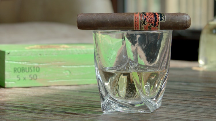 cigar advisor #nowsmoking cigar review rojas street tacos cigar on top of rocks glass with spirits