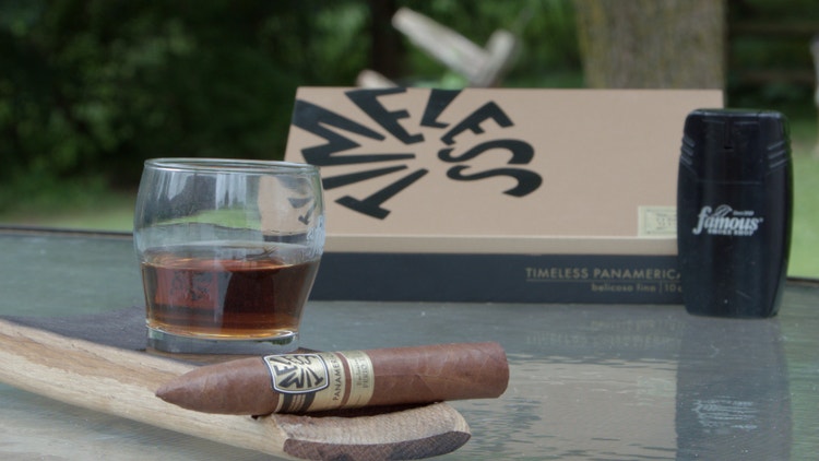 cigar advisor #nowsmoking cigar review ferio tego timeless panamericana - cigar and whiskey glass with box in the background
