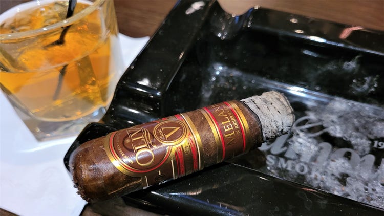 cigar advisor #nowsmoking cigar review oliva serie v melanio edicion limitada 460 on ashtray with drink in the background