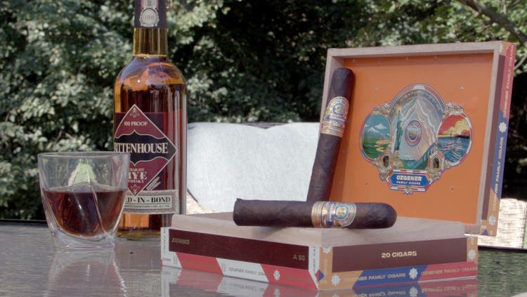 cigar advisor my weekend cigar review ozgener family aramas - setup shot of the cigars, box, and whisky in the background