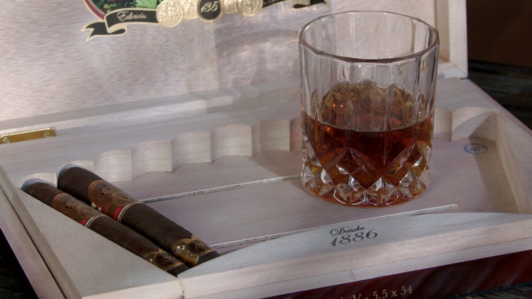 cigar advisor panel review oliva serie v 135th anniversary setup 2 cigars and whiskey glass in open box