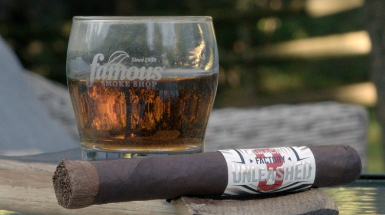 cigar advisor my weekend cigar camacho factory unleashed 3 - setup shot of cigar with famous smoke shop whisky glass behind