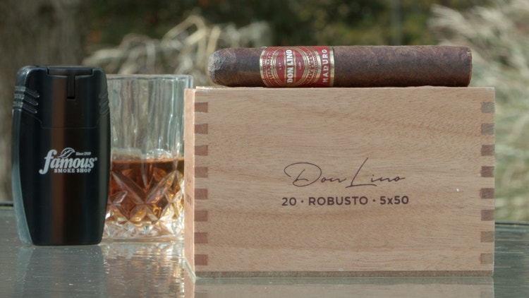 cigar advisor #nowsmoking cigar review don lino maduro setup shot of cigar on top of box next to a lighter and whiskey glass