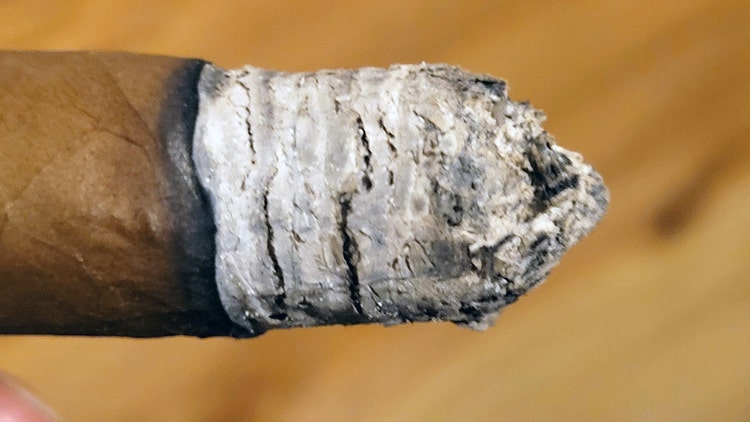 The ash on the end of a Camacho Corojo cigar