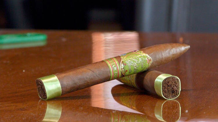 cigar advisor panel review don pepin garcia vegas cubanas - setup shot of two cigars on a wooden table