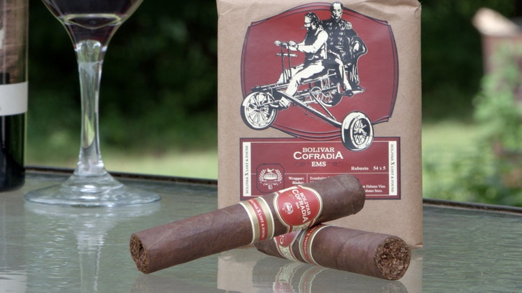 cigar advisor #nowsmoking cigar review Bolivar Cofradia Lost and Found - cigars and red wine on a table top