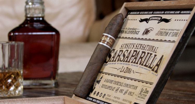 cigar advisor now smoking video cigar review sensei's sensational sarsaparilla setup 1 with cigar on box and whiskey in background