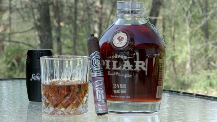 cigar advisor #nowsmoking cigar review pdr 1878 santiago maduro - drink pairing with cigar, whiskey glass, and bottle of spirits in the background