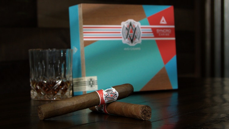 avo caribe toro cigar review cigars in front of their box with a glass of bourbon